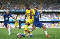 Jesurun Rak-Sakyi (yellow) attempts to dribble past Mateo Kovacic