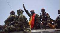 Coup leader Mamady Doumbouya (hands raise) after im meet former ministers dis week