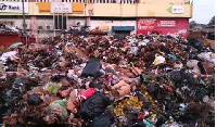 Heaps of rubbish gathered in front of the market