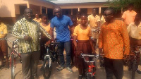 MP for for Agotime-Ziope presenting the bicycles to the students