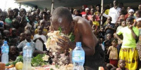 This file photo taken in July 2015 shows a man in an amateur eating contest in Kayunga District