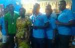 Mrs Horsu Fianu , Eastern Regional Director, Sports Authority (middle)  flanked by the two medalists