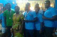 Mrs Horsu Fianu , Eastern Regional Director, Sports Authority (middle)  flanked by the two medalists