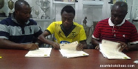 General Manager of Kotoko Opoku Nti, Gyamfi and his Manager during the signing