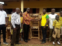 The MCE for the area presenting the desks to the head of  schools