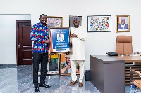 An executive of TESCON presenting a citation to Hon Farouk Aliu Mahama