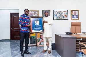 An executive of TESCON presenting a citation to Hon Farouk Aliu Mahama