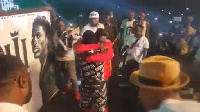 Shatta Wale hugged the fan after he presented the artwork to him