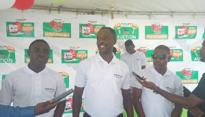 Mr. Israel Boateng (middle) addressing the media during the launch of the online portal