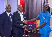 Head of wholesale banking at UBA, Peter Dery and Obi Okwuegbunam presenting prize to overall winner