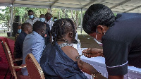 A health worker administers a COVID-19 jab in Tanzania