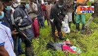 Police and community members at the site where the remains of the 2-year-old was found