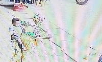 Photograph captured by the CCTV of the woman carrying the child