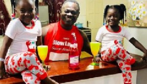 Former Ghana international Nii Odartey Lamptey and his two children