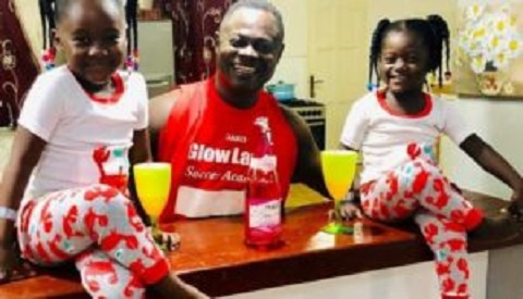 Former Ghana international Nii Odartey Lamptey and his two children