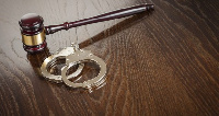 File photo of handcuffs and a gavel