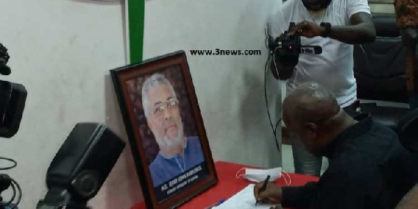 Mahama signing the book of condolence opened in honour of Rawlings at the party headquarters