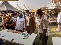 The Western Regional minister and others at an exhibition stand