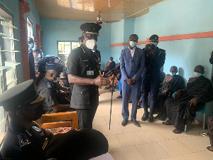 The acting IGP Dr. George Akuffo Dampare (standing) addressing a team in the Bono Region