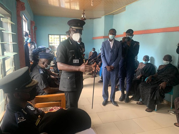 The acting IGP Dr. George Akuffo Dampare (standing) addressing a team in the Bono Region