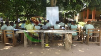 Students of Shai Senior High Technical School learning under a tree