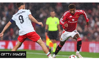 Manchester United striker Marcus Rashford takes on Twente's Ricky van Wolfswinkel at Old Trafford