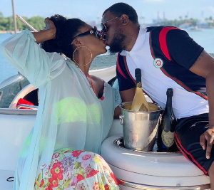 Singer Becca and husband share a kiss