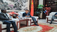 Prof. Annim, the Government Statistician (seated left) with H.E. Shi Ting Wang, the Chinese Ambassad