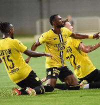 Patrick Twumasi (middle) celebrates with teammates