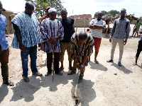 Dabid Sei Demah cutting sod for the construction of a number of projects