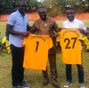 Wolverhampton Wanderers official Seyi Olofinjana and AshantiGold's Dr Kwaku Frimpong and CEO Frederi