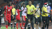 Guinea Bissau player, Frederic Mend reacts in disappointment after referee Pacifique