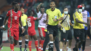 Guinea Bissau player, Frederic Mend reacts in disappointment after referee Pacifique