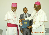 Archbishop Charles Palmer-Buckle handing over his position to Most Rev. John Bonaventure Kwofie