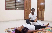 Thai Massage expert Yaw Tutu working on a client.