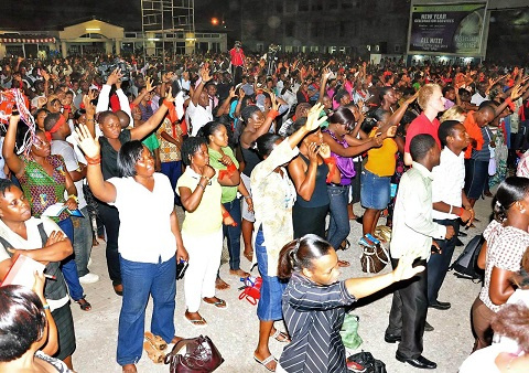 Congregants in church praying