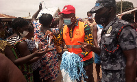 Sunyani West Municipal Chief Executive distributing re-washable nose masks