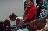 Aisha Huang with her galamsey workers at a court hearing