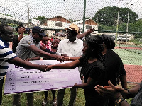 The team presented a cheque to Mrs. Barbara Mahama