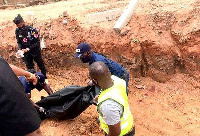 Body of the deceased being carried away by officers from the Ghana Police Service