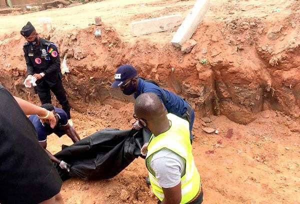 Body of the deceased being carried away by officers from the Ghana Police Service