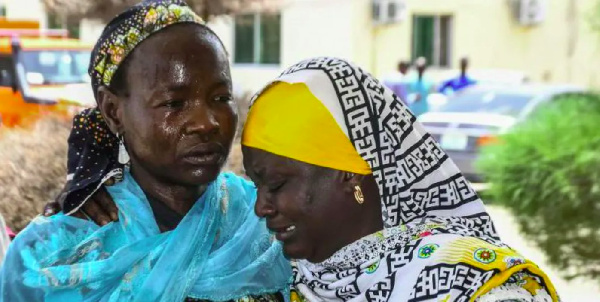 Relatives of victims console themselves after the spate of suicide bomb attacks that hit Gwoza