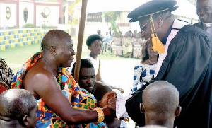 Right Rev Professor Joseph Obiri Yeboah Mante exchanging pleasantries with Otumfuo Osei Tutu