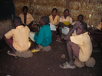 File photo: Pupils sit on stones