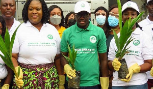 Godfred Dame and others during the tree planting exercise