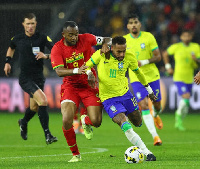 Black Stars forward, Jordan Ayew in a tussle with Brazil's Neymar