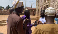 Lawyer Ralph Poku Adusei interacting with leaders of the Bekwai Zongo community