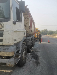 The truck was parked on the shoulder of the road