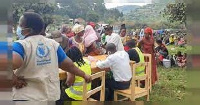 Congolese fleeing volcano register at camp in neighboring Rwanda