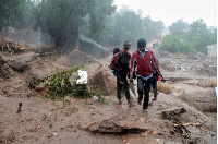 Residents survey the damage caused by Cyclone Freddy in Chilobwe, Blantyre, Malawi